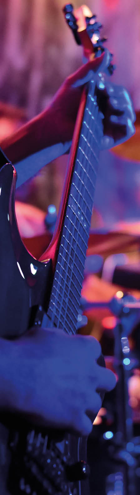 Drummer and Guitarist during a live music concert