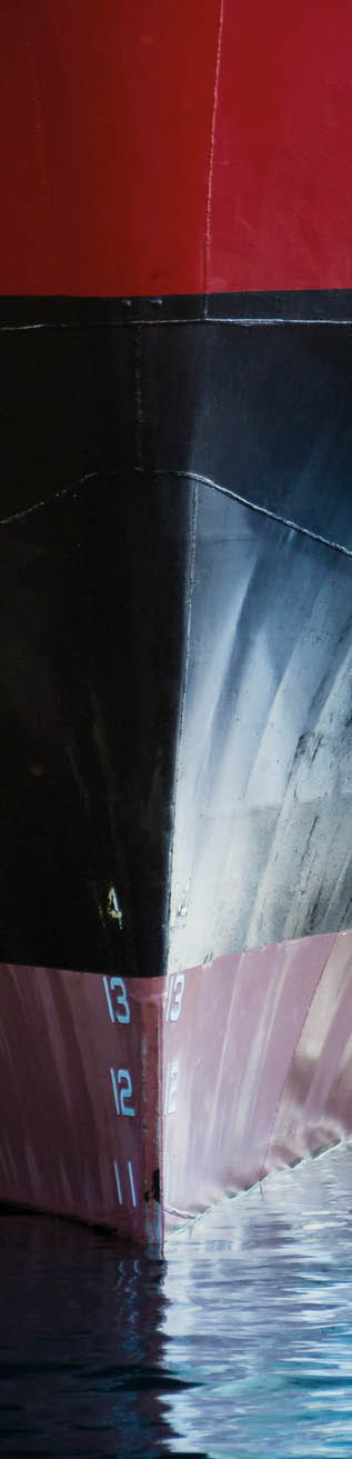 A beautifull horizontal graphic view of the bow of a large ship in port. It would make a great image forf anything involving international shipping; transportation; industrial cargo or ferry.