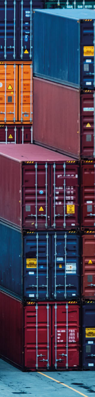 Shipping containers stacked high at a container pier.