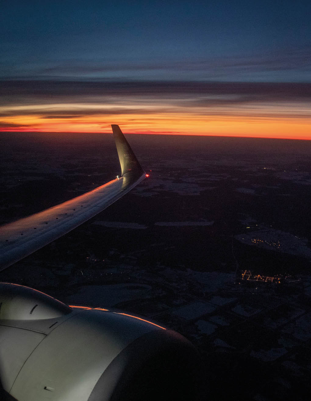 A sunrise over the Vilnius region of Lithuania from the point of view of an ascending Boeing 737.