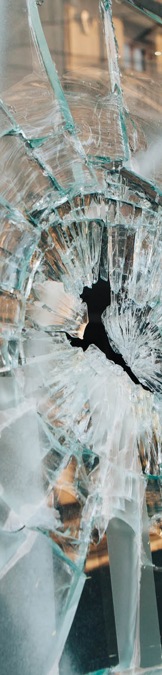 Shop window broken by riots in Chile